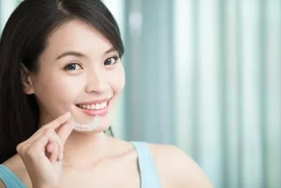 woman loving her cosmetic dentistry results from Pendleton Smiles
