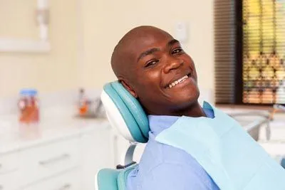 man smiling during his first visit to Pendleton Smiles